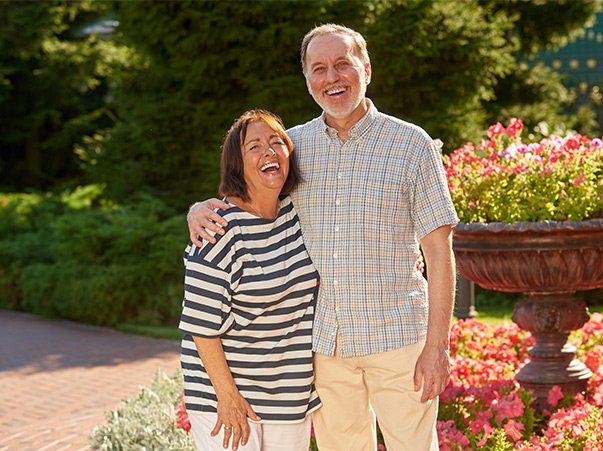 portrait of senior couple in a garden life insurance for retirement cedar rapids ia